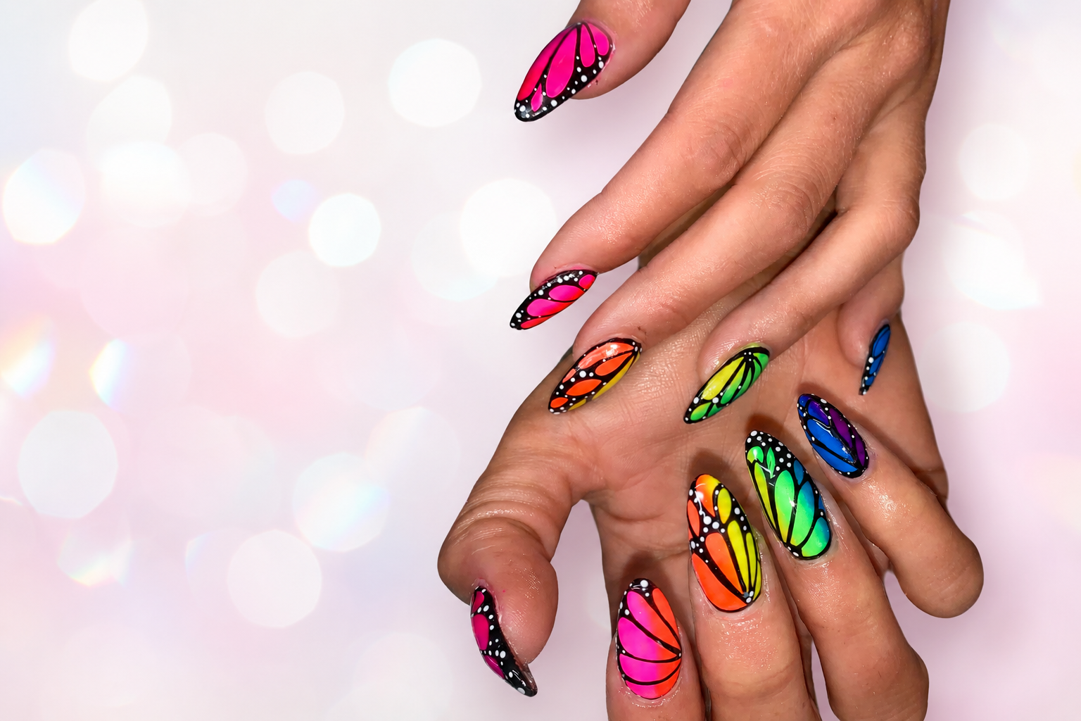Vibrant rainbow butterfly nail art